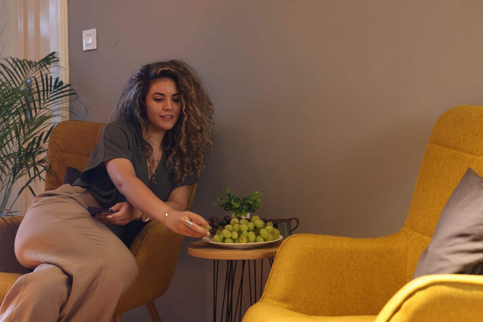 brankova hub lobby armchairs, girl and fruits